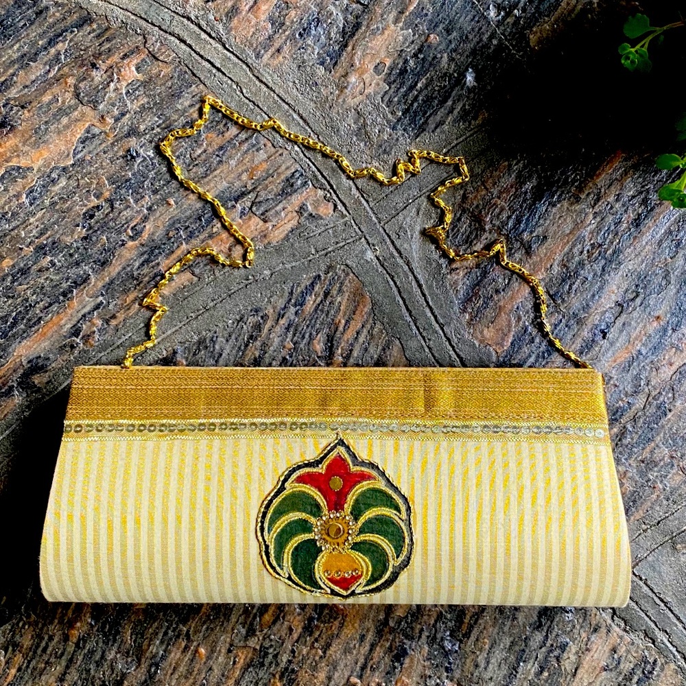 Embellished clutch bag with shoulder strap